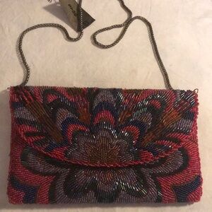 Pink and Blue Crossbody Bag with Intricate Design